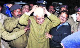 Former Andhra Pradesh Governor ND Tewari adjusts his Gandhi cap on his return to Dehradun from Hyderabad on Monday. 