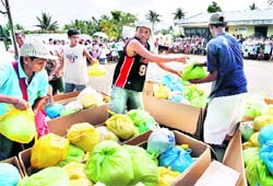 Relief workers prepare food rations for Mayon volcano evacuees in Sto Domingo town, Albay province, south of Manila on Monday
