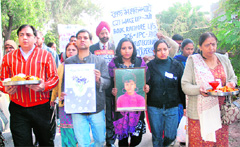 Family members and friends of Aradhana take out a march in memory of Ruchika in Panchkula on Tuesday.