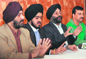 Gagandeep Singh (second from left), son of Sham Mall owner Amarjit Singh, at a press conference in Sector 34, Chandigarh, on Tuesday.