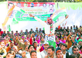 Congress workers stage a demonstration in Dehradun on Tuesday