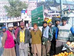 Coolies await customers at Mandi