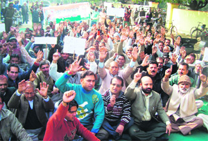 Activists of the Anusuchit Jaati Aarakshan Bachao Manch hold a protest against the ban on inter-district recruitment at Hiranagar in Kathua on Tuesday.