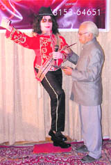Chander Shekhar Prabhakar gives finishing touches to a wax sculpture ofpop star Michael Jackson in Ludhiana.