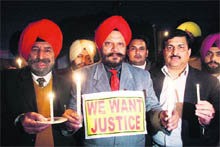 People light candles outside Nehru Garden in Jalandhar on Tuesday seeking justicein the Ruchika case