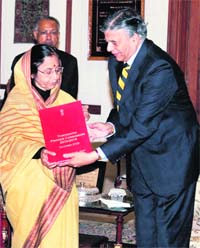 President Pratibha Devi Singh Patil receives the 13th Finance Commission report from Commission chairman Vijay Kelkar at President House in New Delhi