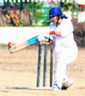 A player hits a shot during a match organised by the Uttarakhand Cricket Association in Dehradun