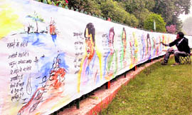 An artist prepares a 60-feet painting on the main events of 2009, in Allahabad on Wednesday
