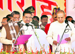 Jharkhand Governor K Sankaranarayanan administers the oath of office to the new Chief Minister Shibu Soren on Marabadi Grounds in Ranchi on Wednesday