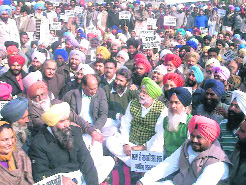 Congress workers stage a protest in front of the SSPs office in Tarn Taran on Wednesday.