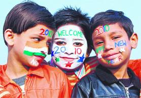 Children with their faces painted to welcome the New Year in Amritsar on Wednesday.