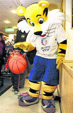 Delhi Games mascot Shera plays with children in Gurgaon on Wednesday
