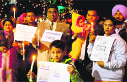 Protesters take out a candle march against the misuse of Section 498-A (dowry harassment) at the Sector 17 plaza, Chandigarh, on Thursday.