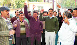 Doctors hold a demonstration in front of the Doon Hospital in Dehradun on Thursday