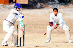 A player cuts the ball during a match in the District Women Cricket League in Dehradun on Thursday