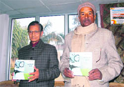A book of Garhwali folk tales being released by its author Partap Shekhar (right) in Dehradun on Thursday.