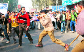 Policemen lathicharge daily wage workers of the Power Development Department in Jammu on Thursday