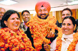 Newly elected Chandigarh Municipal Corporation Congress candidates: Mayor Anu Chatrath, Senior Deputy Mayor Bhupinder Singh Bhadehri and Deputy Mayor Sheela Devi after winning mayoral elections on Friday at the MC office in Sector 17, Chandigarh.