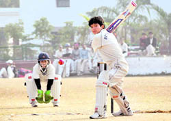 A player attempts a shot in the Womens District Cricket League in Dehradun on Friday