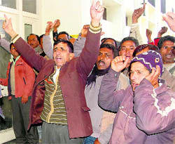 PWD employees lock their office at Yamuna Colony in Dehradun on Friday.
