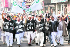 Bharatiya Kisan Union members hold a rally in karmnal against the  Apna Transformer scheme on Friday