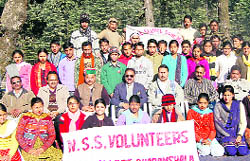 NSS volunteers of a college pose along with their teachers at Dharamsala on Friday.