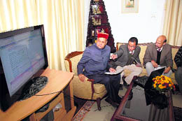 Chief Minister Prem Kumar Dhumal launching e-Samadhan at his official residence in Shimla on Friday.