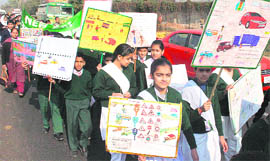Schoolchildren participate in a traffic awareness rally in Jammu on Friday