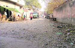 A road awaits recarpting at Sunet village
