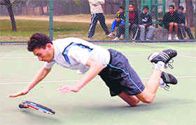 Garry Singh falls on the court during a match of the Chandigarh ITF World Ranking Junior Tennis Tournament in Chandigarh on Saturday.