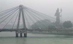 A panoramic view of the Shiv statue near Har-ki-Pauri as fog covers Haridwar on Saturday