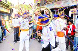 Sikh youths play the gatka at the Prakash Utsav of Guru Gobind Singh in Dehradun