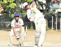 A batsman plays a shot during a match at the under-17 District Cricket League in Dehradun