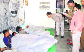 Policemen enquire about the health of five PWD workers who are on an indefinite fast in support of their demands in Dehradun on Saturday.