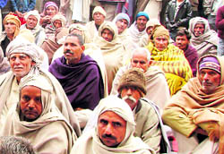 Villagers attend Deepender Hoodas meeting at a village in Kosli segment on Saturday.