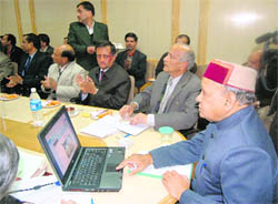 Chief Minister Prem Kumar Dhumal launching the HP State Vigilance and Anti-Corruption Bureau website at Shimla on Saturday. 