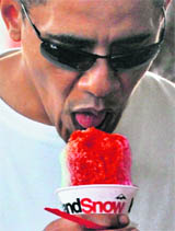  US President Barack Obama enjoys a shave ice in Hawai on Saturday. The First Familyis on a vacation there.