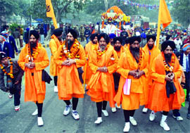 Sikh devotees participate in Nagar Kirtan in connection with Guru Gobind Singhs birthday celebrations in New Delhi on Sunday.