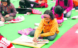 Children participate in a painting competition held by the Gunjan magazine in Dehradun on Sunday.