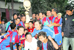 Doon Star team members with the trophy of the Khadag Bahadur Memorial Football tournament in Dehradun on Sunday.