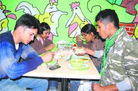 People enjoy a meal at Egg Hut in Dehradun