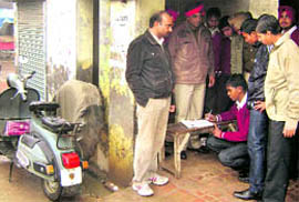 Cops guide students of MGMN Senior Secondary School, Ahmedgarh, in filing challans at Jandali Road on Sunday.