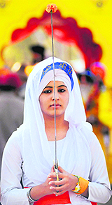 A Sikh devotee at a nagar kirtan on the eve of the 344th birth anniversary of Guru Gobind Singh in Bhopal on Sunday.