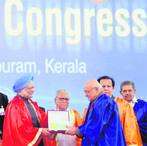 Prime Minister Manmohan Singh presents an award to a scientist at the 97th Indian Science Congress in Thiruvananthapuram on Sunday.