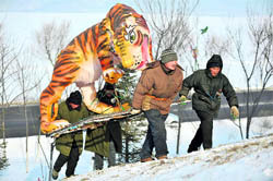 Workers carry a tiger-shaped lantern as they prepare for a lantern show at a park in Shenyang, Liaoning province, on Sunday. According to the Chinese lunar calendar, the year of the tiger begins on February 14, 2010