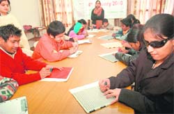 Visually challenged students paricipate in a Braille contest in Chandigarh