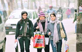 Girls wrapped in woollens all prepared to face chilly conditions