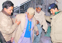 PWD employees, who were on an indefinite fast, being taken away by policemen in Dehradun on Monday.