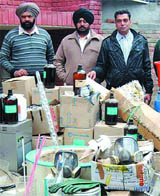 CI officials with the seized stuff. 