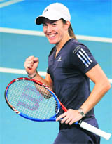 Justine Henin celebrates beating Nadia Petrova at the Brisbane International tennis tournament on Monday.